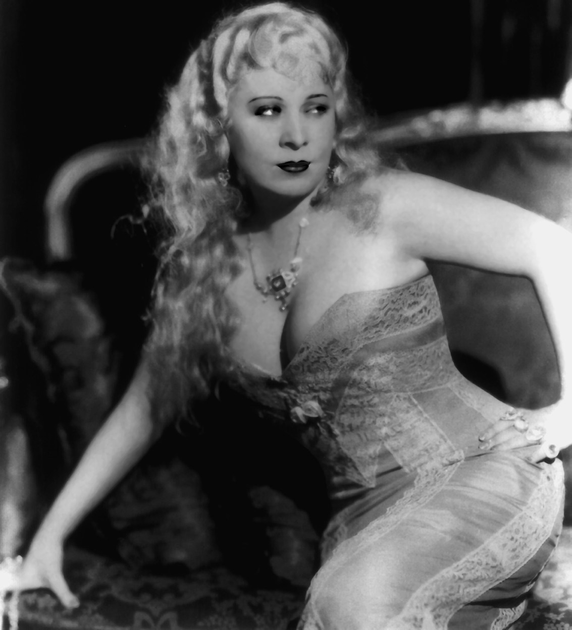 Mae West displaying her cleavage